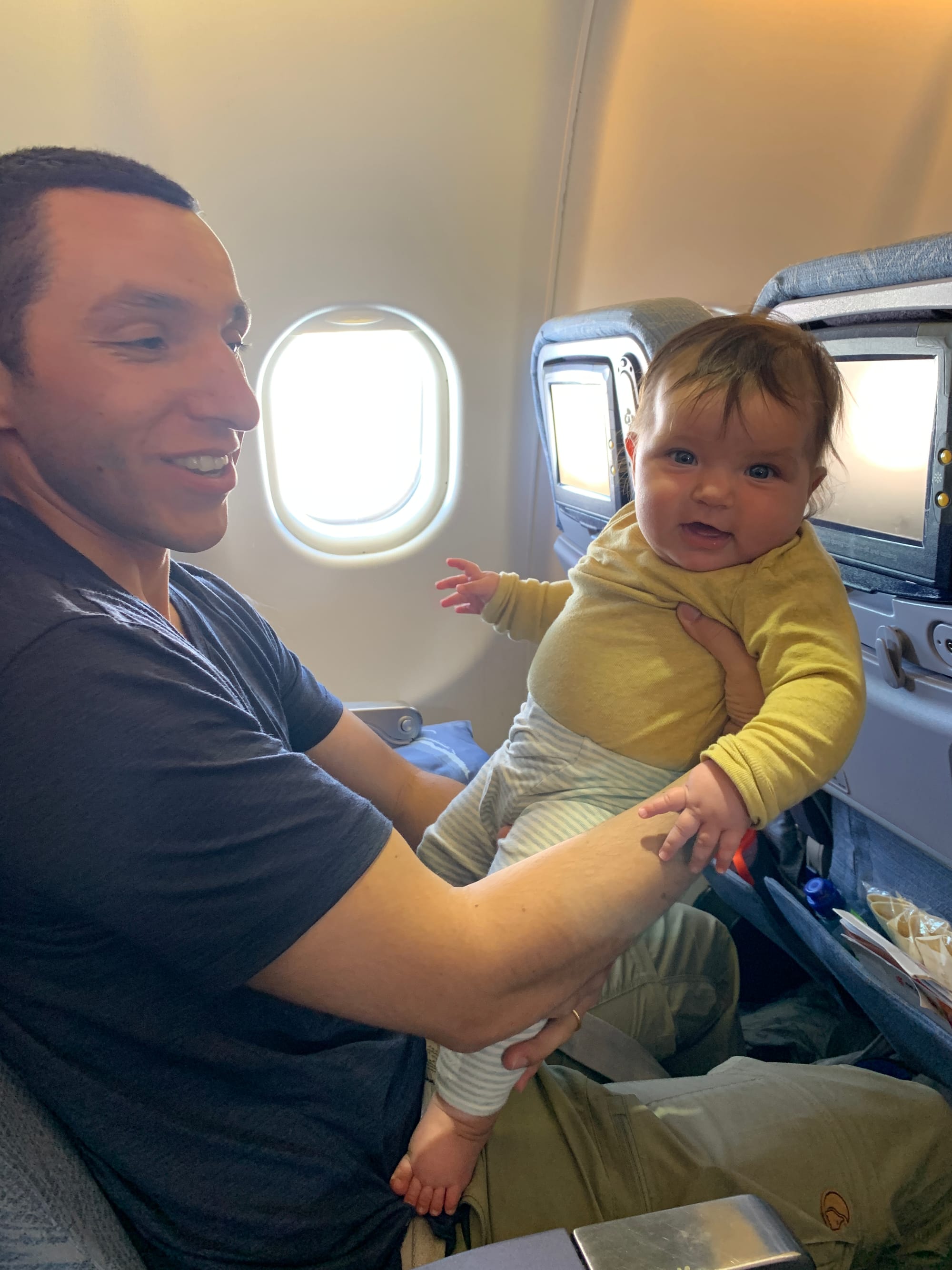 4.5 month old Nina sleeping on an airplane during a flight to China