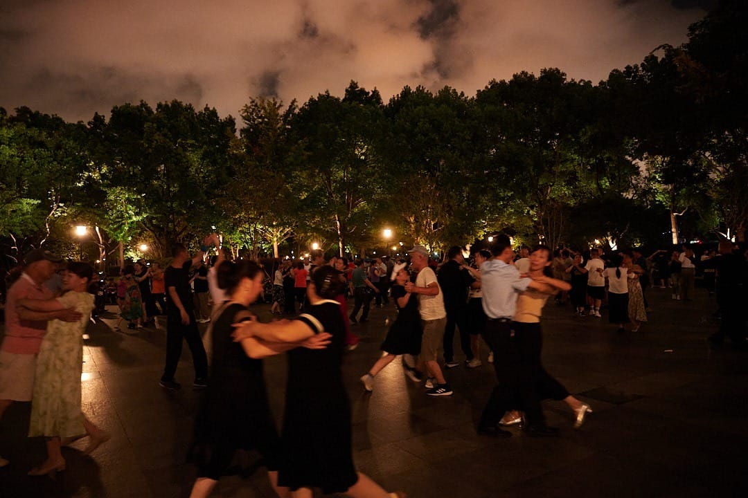 Crowds of dancing people in Zhongshan Park in Shangshai